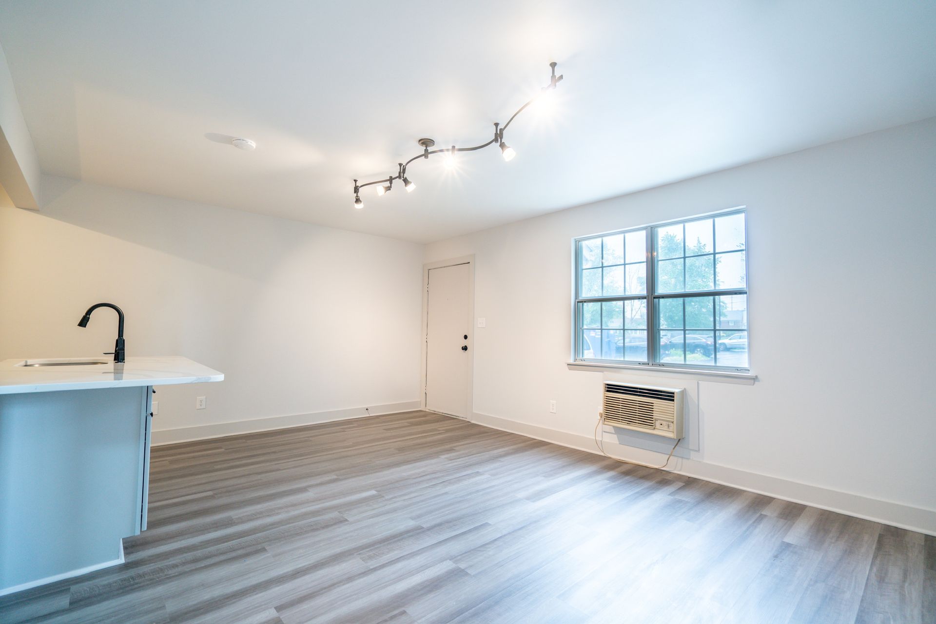Photo of a living room, showing an AC unit present