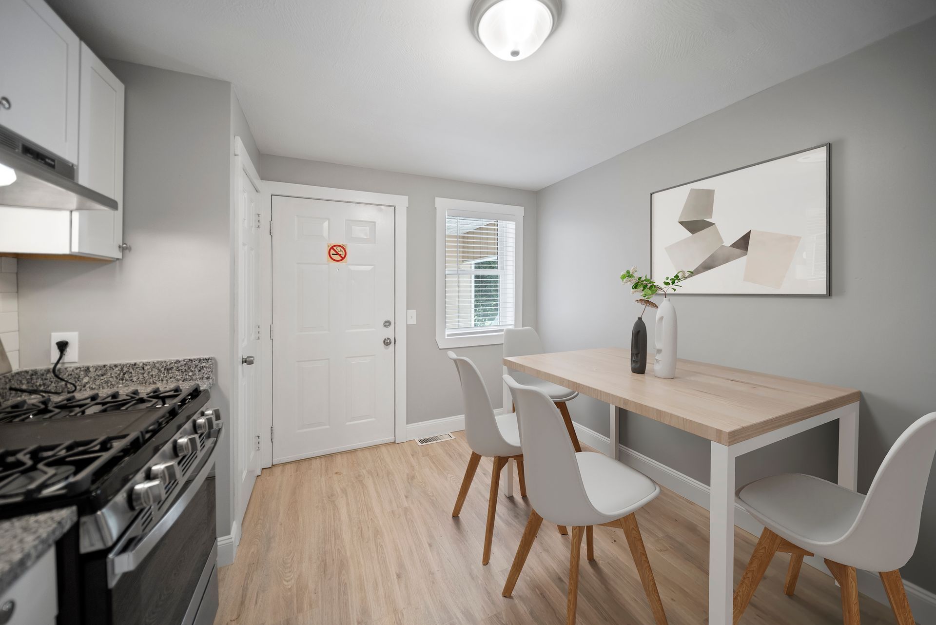 Interior photo of 58 Perham St  kitchen with a table and chairs and a stove.