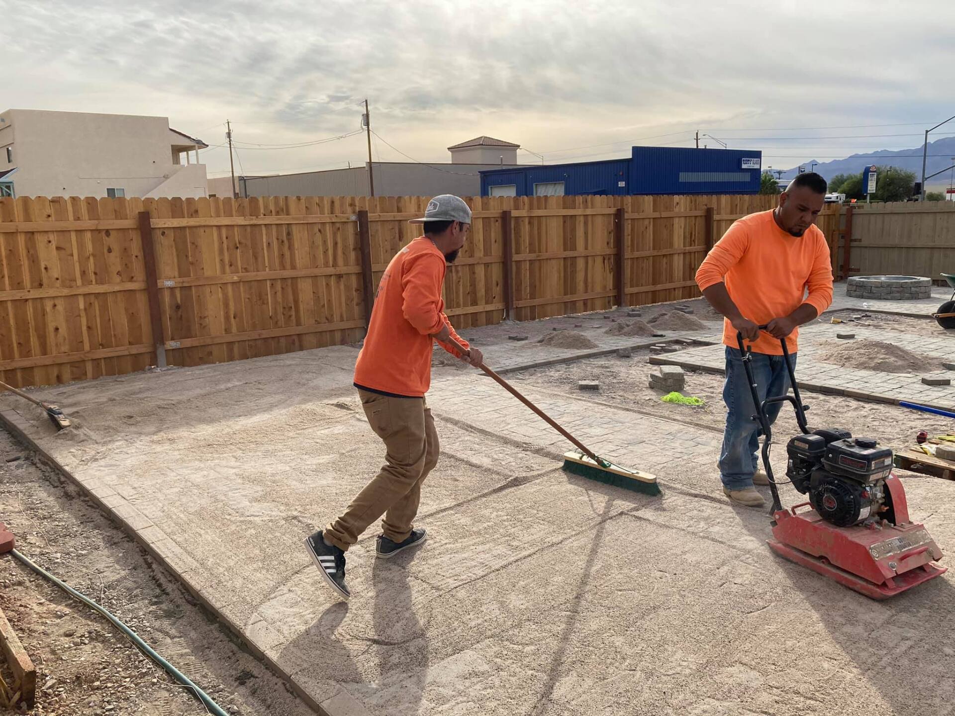 Two construction workers are working on a construction site.