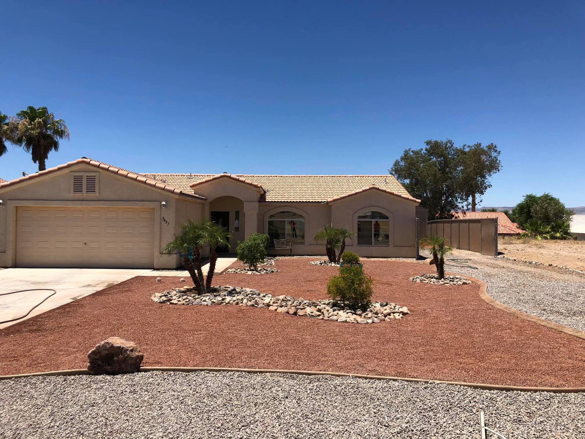 A house with a lot of rocks in front of it