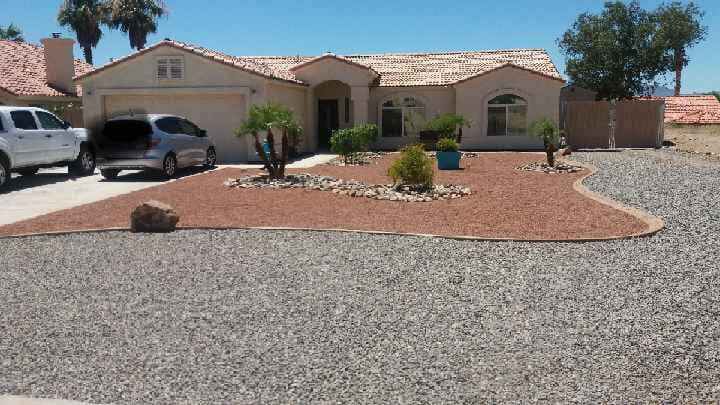 A white van is parked in front of a house.