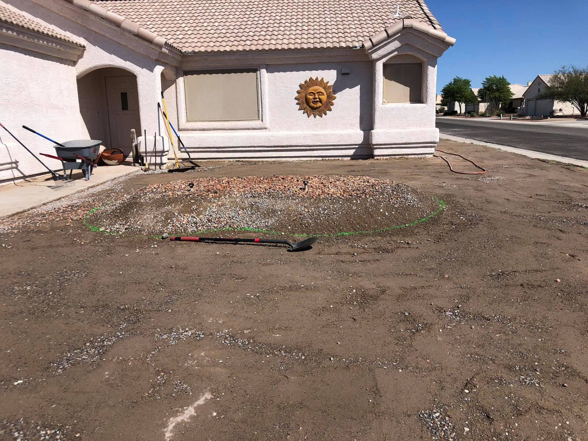 A white house with a sun on the side of it