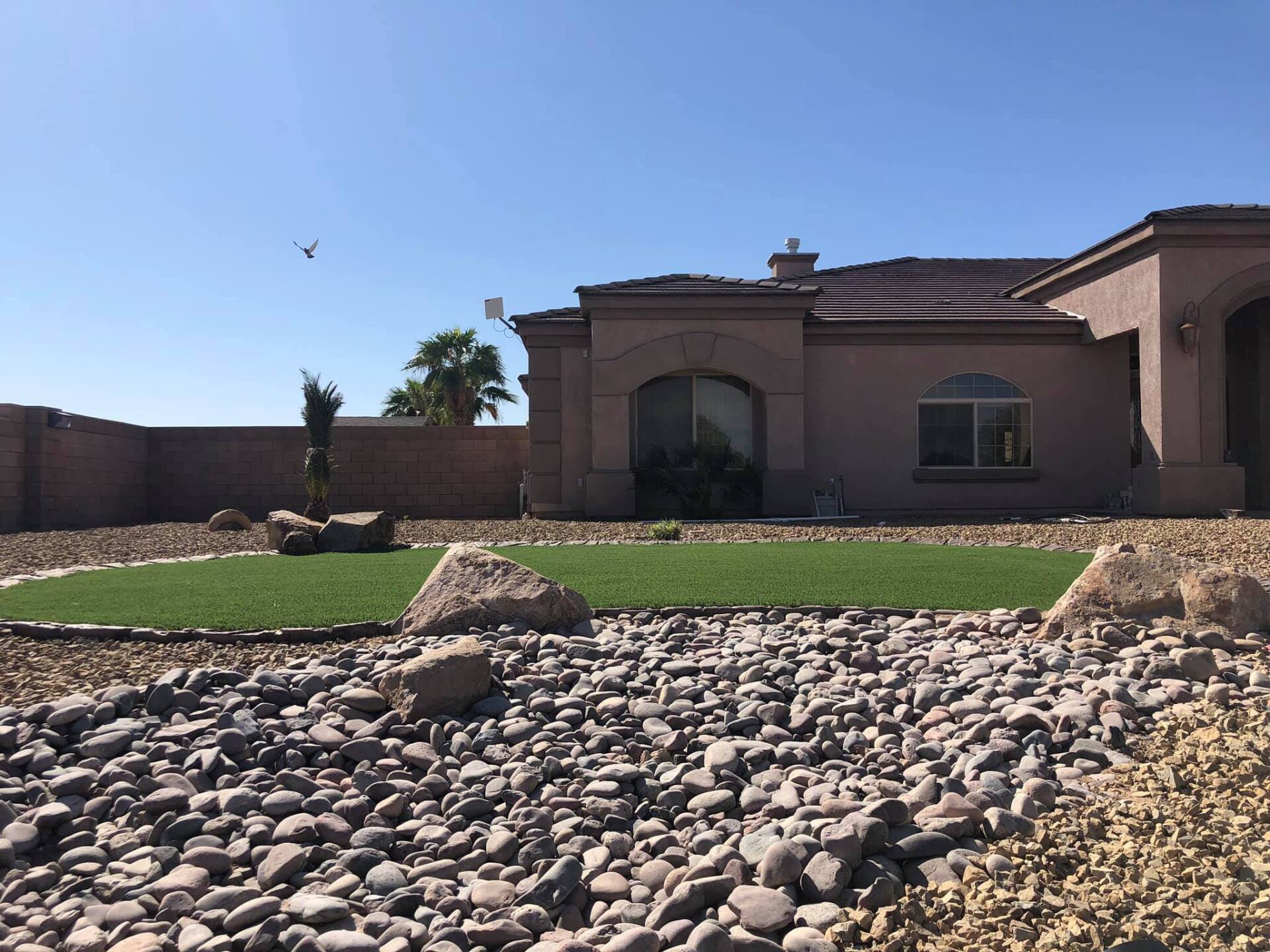A house with a grassy area in front of it