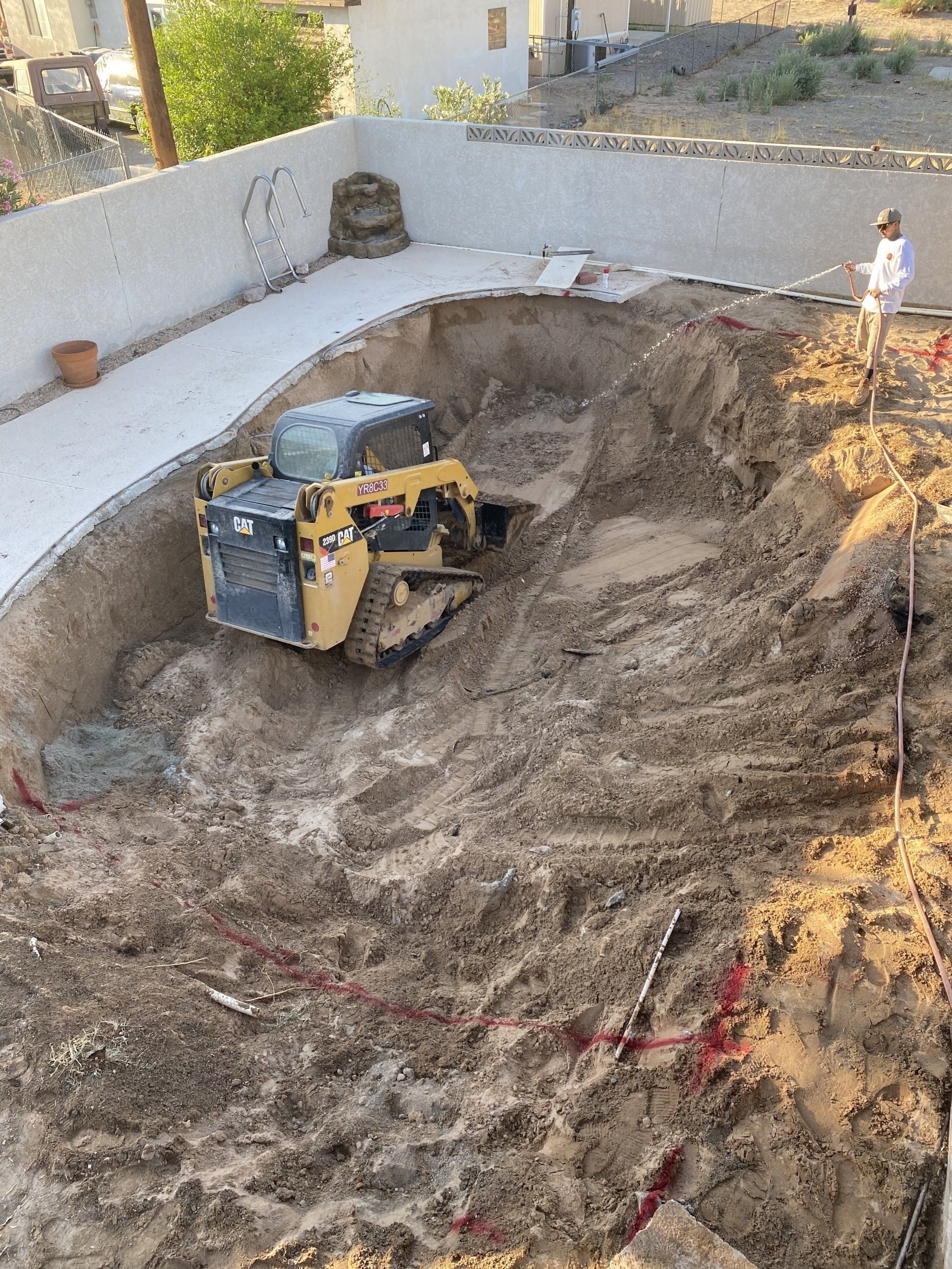 A bulldozer is digging a hole in the ground.