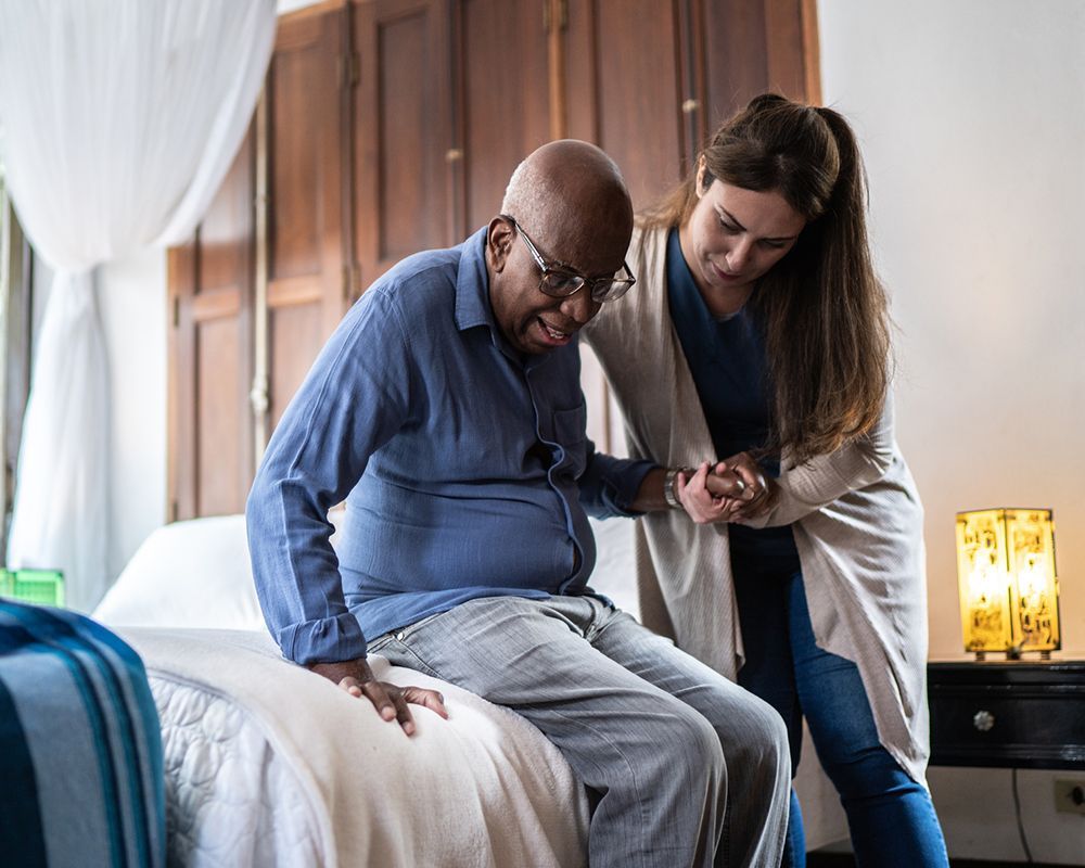 Home Caregiver Helping a Senior Man Standing Up — Semmes, AL — My Happy Seniors