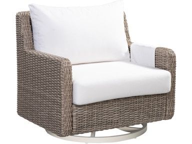 A wicker chair with a white cushion on a white background