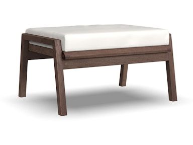 A wooden ottoman with a white cushion on a white background.