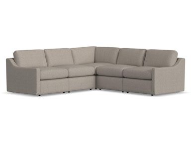 A beige sectional couch on a white background.