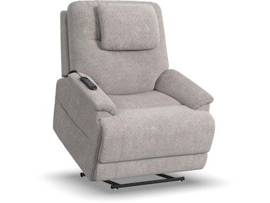 A grey recliner with a remote control on the arm.