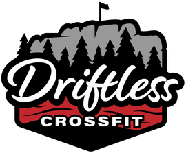 Driftless CrossFit logo: mountain and pine trees, red and black framing, white script text.