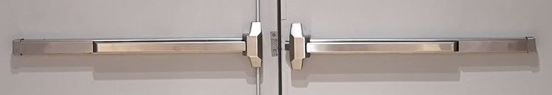 A close up of a door with stainless steel handles.