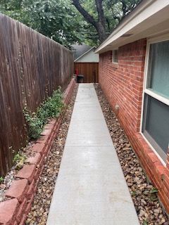 Brick House with A Concrete Walkway