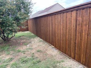 Wooden Fence Is in The Backyard of A House