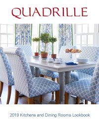 Quadrille 2019 Kitchens and Dining Rooms Lookbook cover.  Dining room with patterned chairs, white table, and blue patterned curtains.