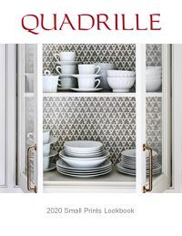 Quadrille lookbook cover featuring open white cabinet with white dishware.