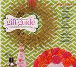 Gift guide cover: pink, gold, and green decorations, text 