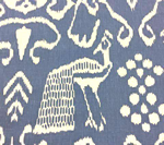 Blue fabric with white ikat pattern; includes a peacock and floral and geometric shapes.