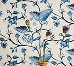 Blue and white floral fabric with bird and plant pattern.