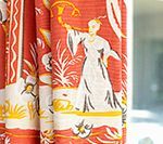 Red curtain with Asian figure holding up an object, amidst floral and plant designs.