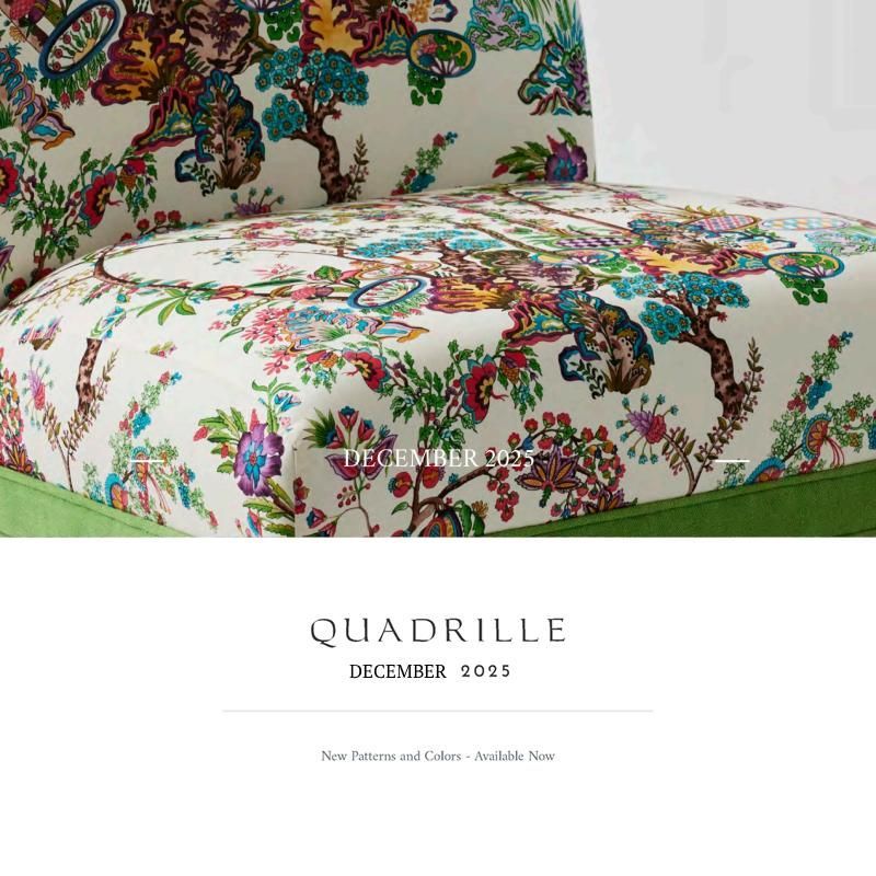 Close-up of a chair with floral patterned fabric, green trim. 