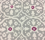 Gray and white patterned fabric with purple accents.