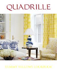 Yellow and blue interior design: drapes, pillows, lamp, and armchair. 