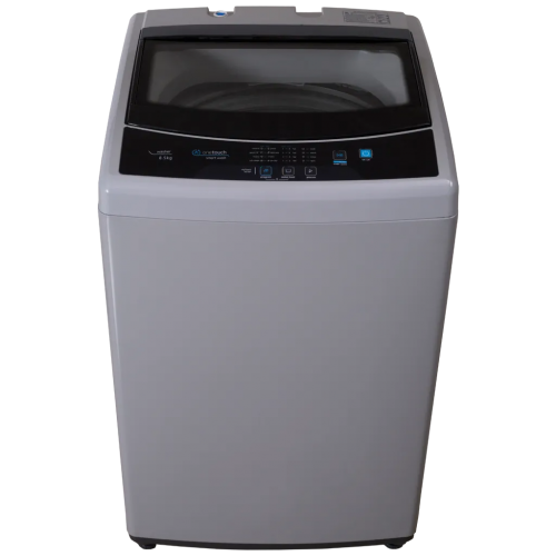A washing machine is sitting on a white surface.