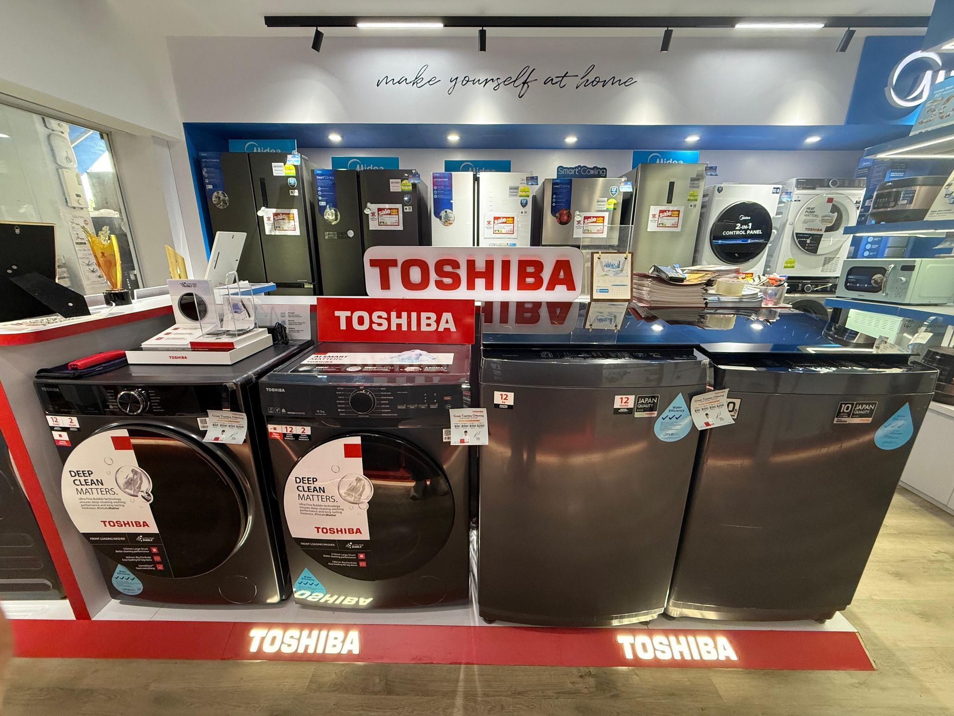 A display of toshiba appliances in a store.