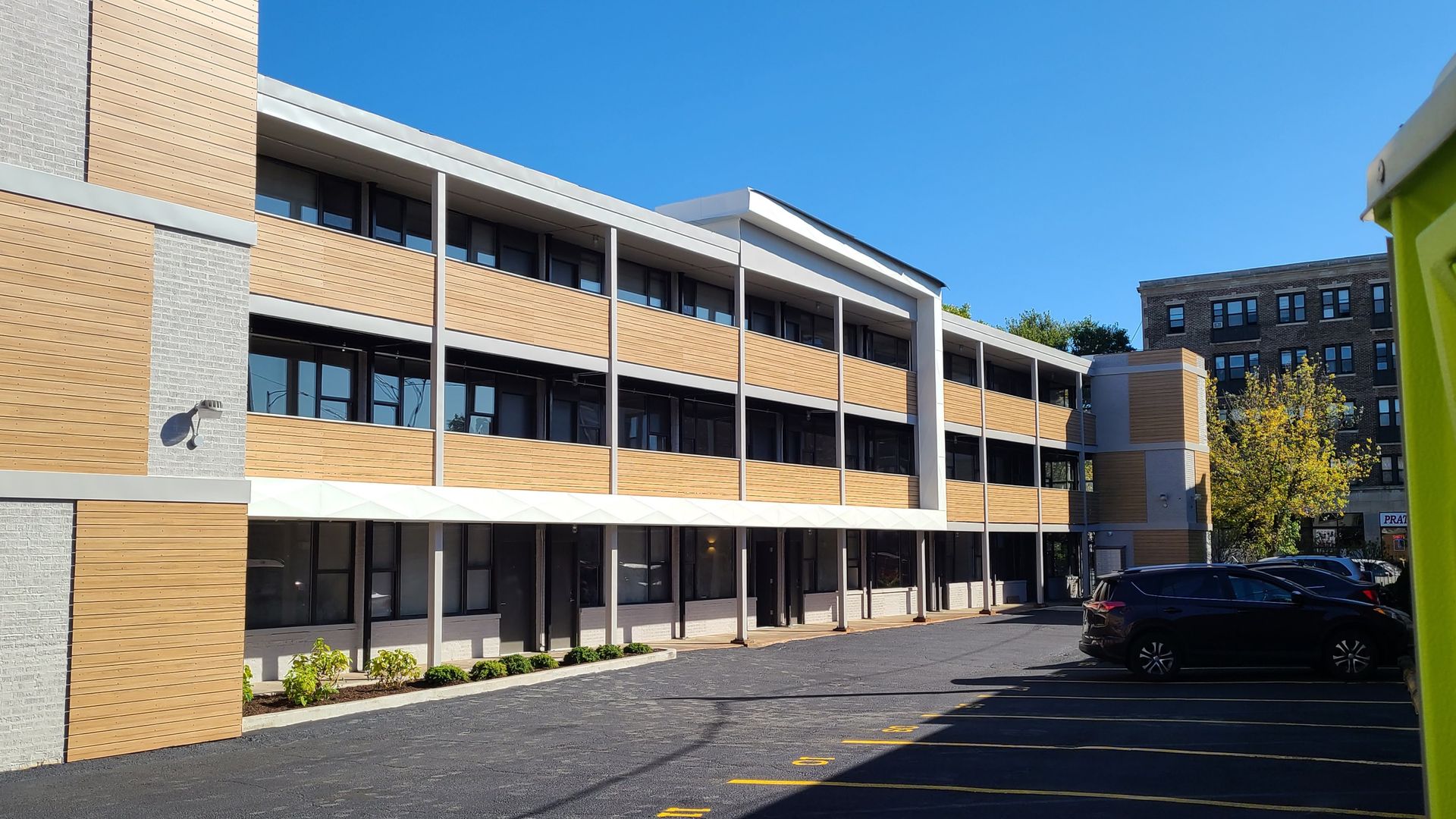 A large building with cars parked in front of it