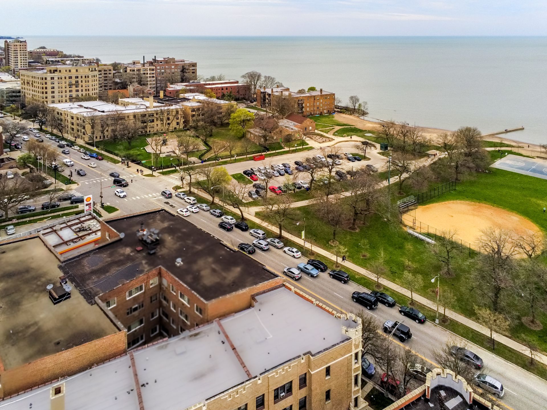 An aerial view of a city with a large body of water in the background.