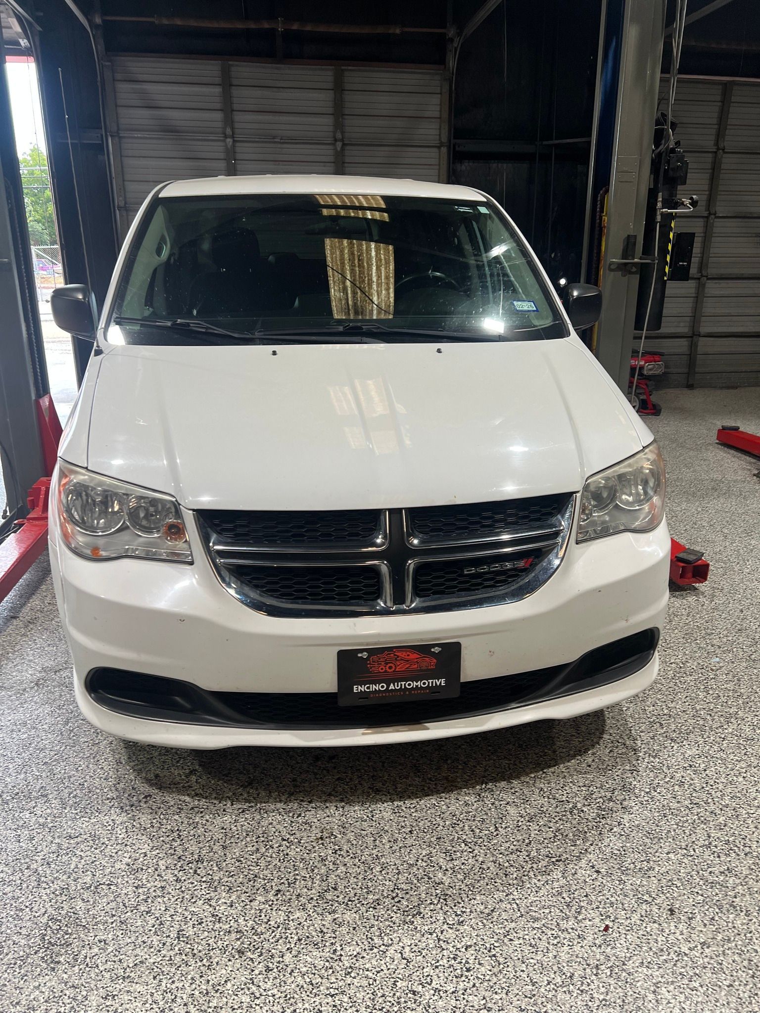 White Car Inside of Shop | Encino Automotive