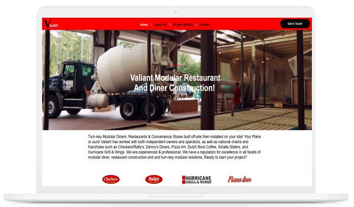 A laptop screen shows a website for a restaurant