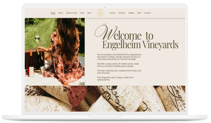 A laptop screen displays the website for engelheim vineyards