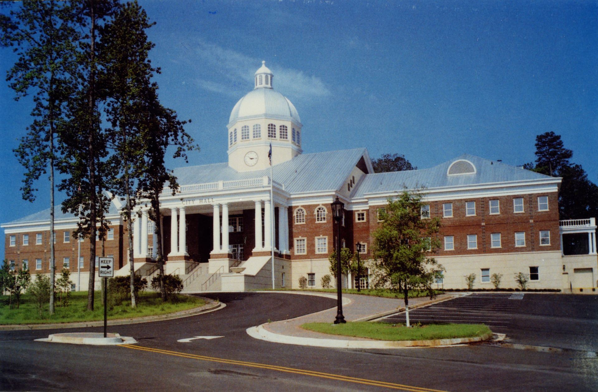 Roswell City Hall, a large brick building with a dome on top of it