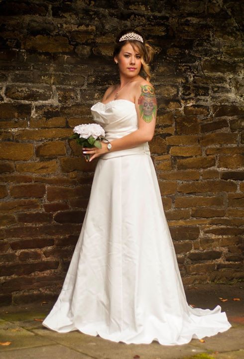 Wedding photography - Bride posing with a flower
