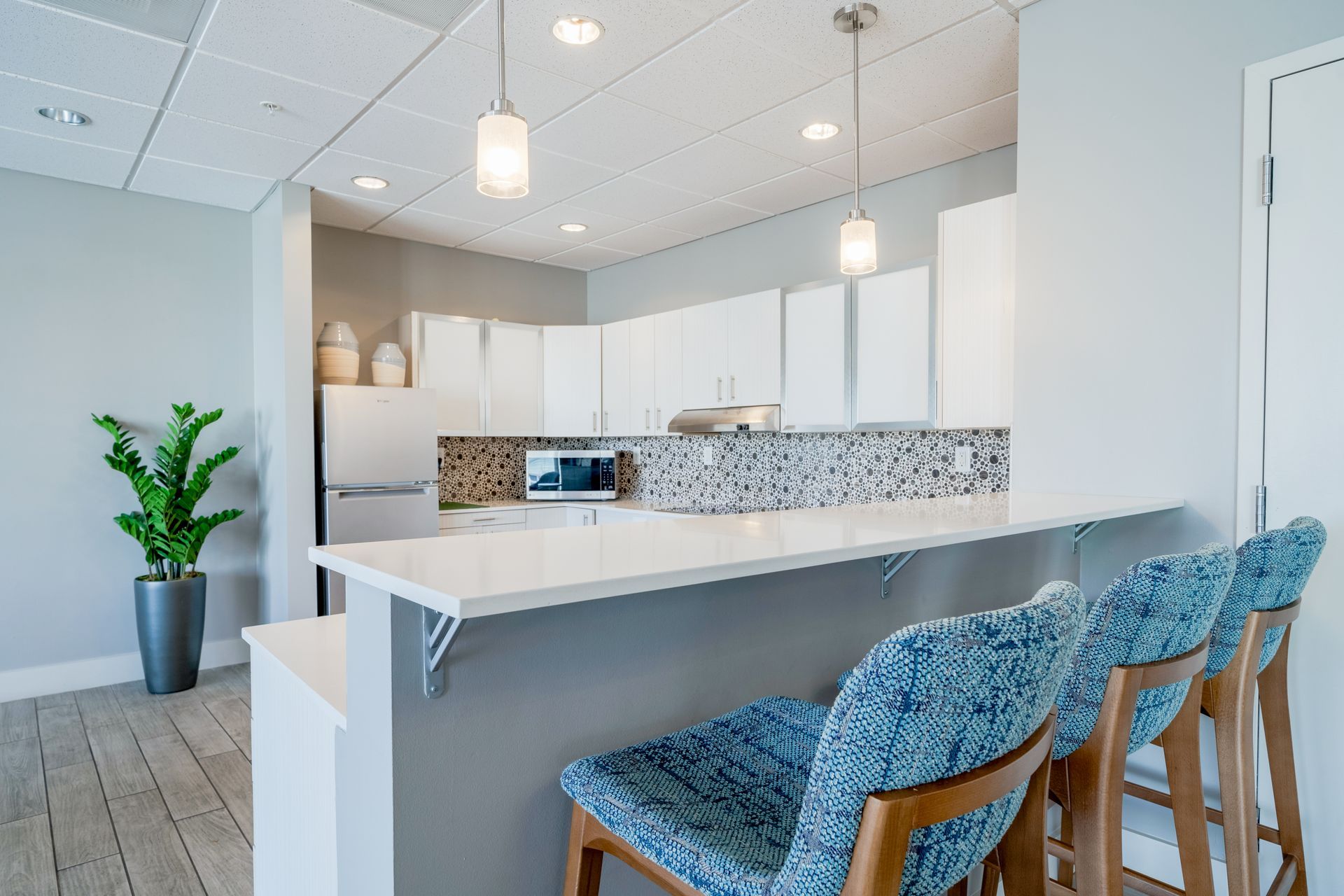 Luxury apartment kitchen with breakfast bar at Wellington Parkside.