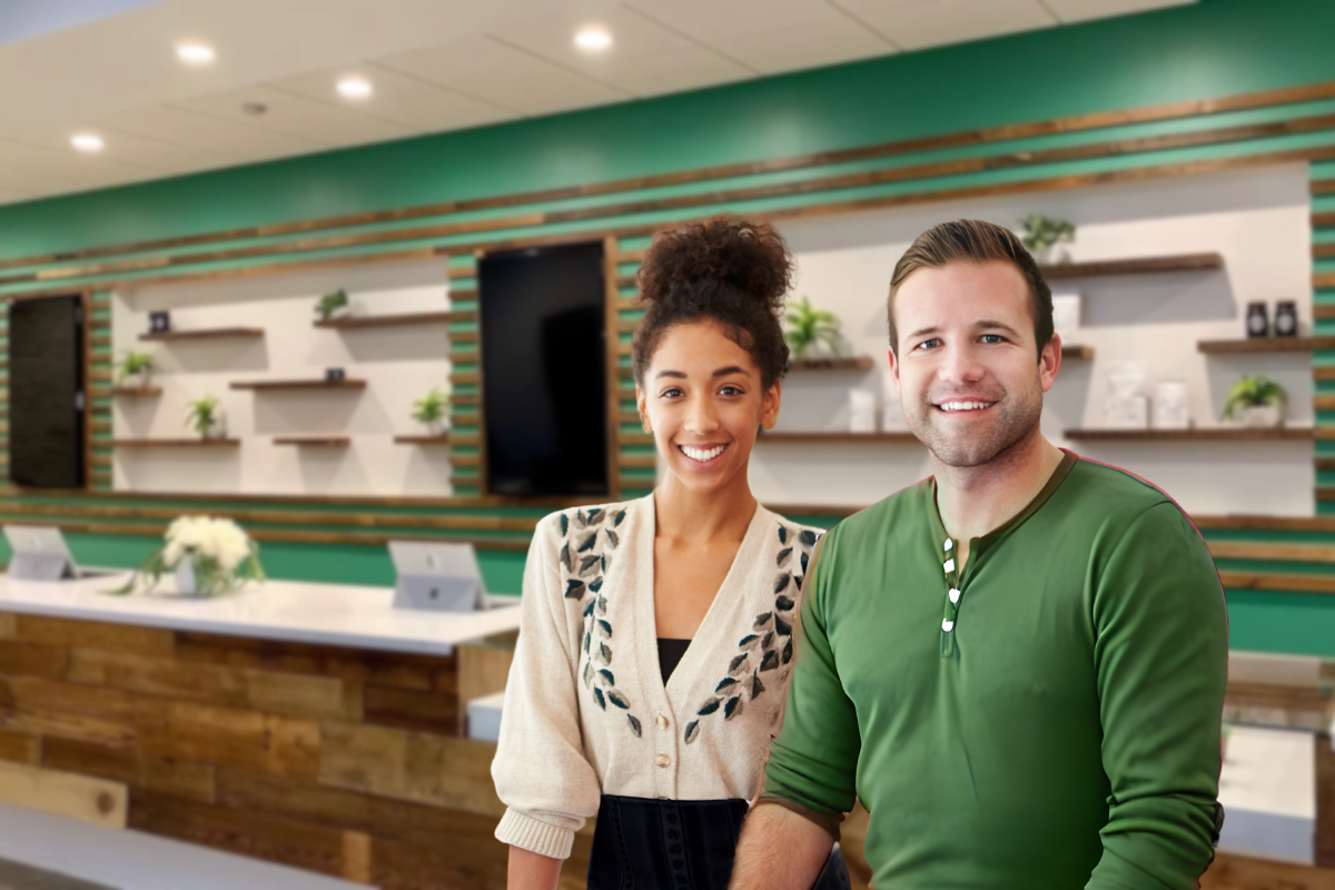 A man and a woman are standing next to each other in a room.