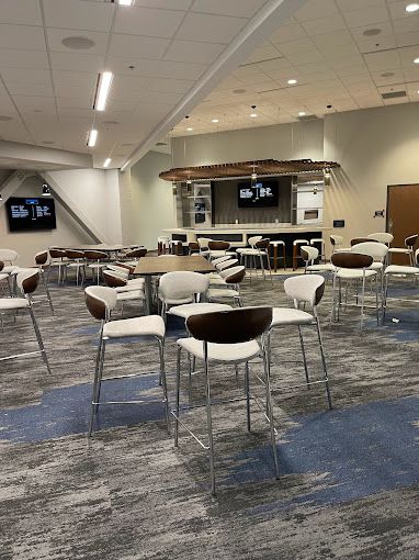 A large room with tables and chairs in it