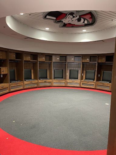 A locker room with a picture of mickey mouse on the ceiling.