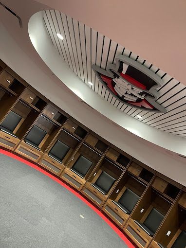 A locker room with a skull on the ceiling