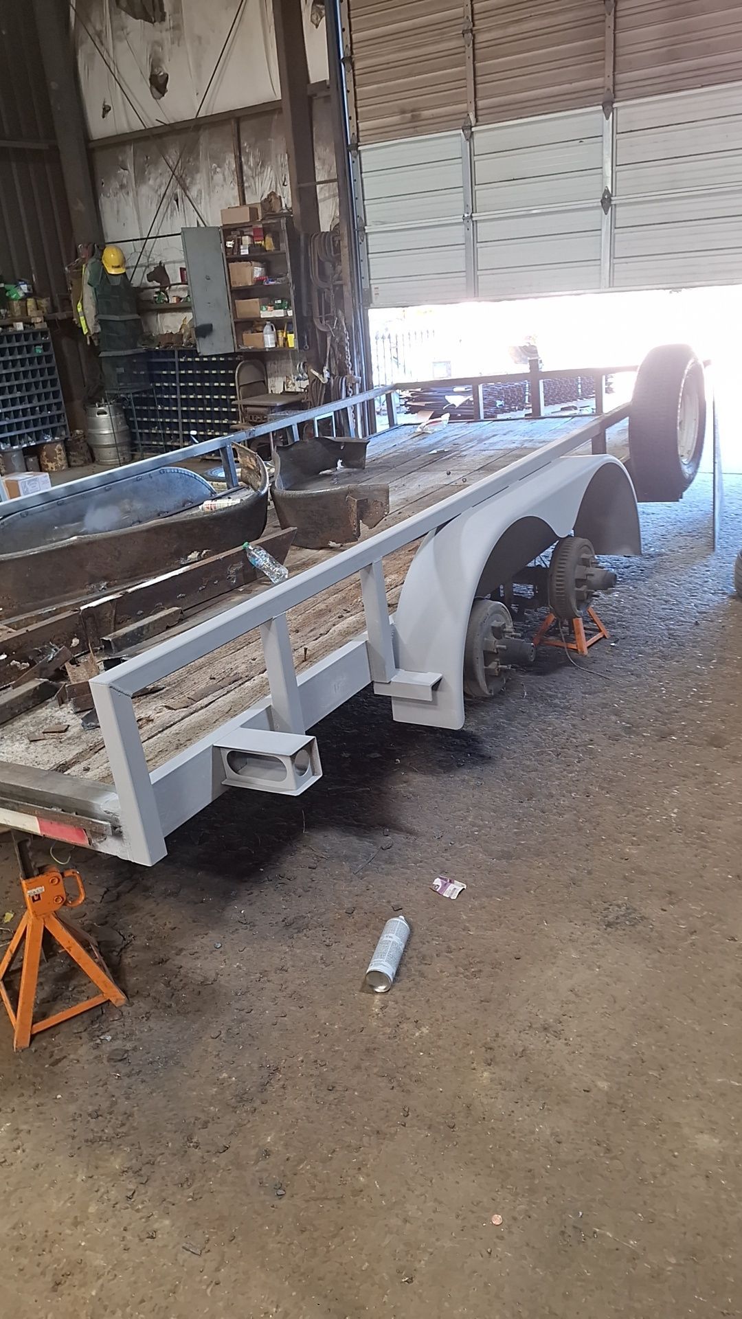 A trailer is being built in a garage.