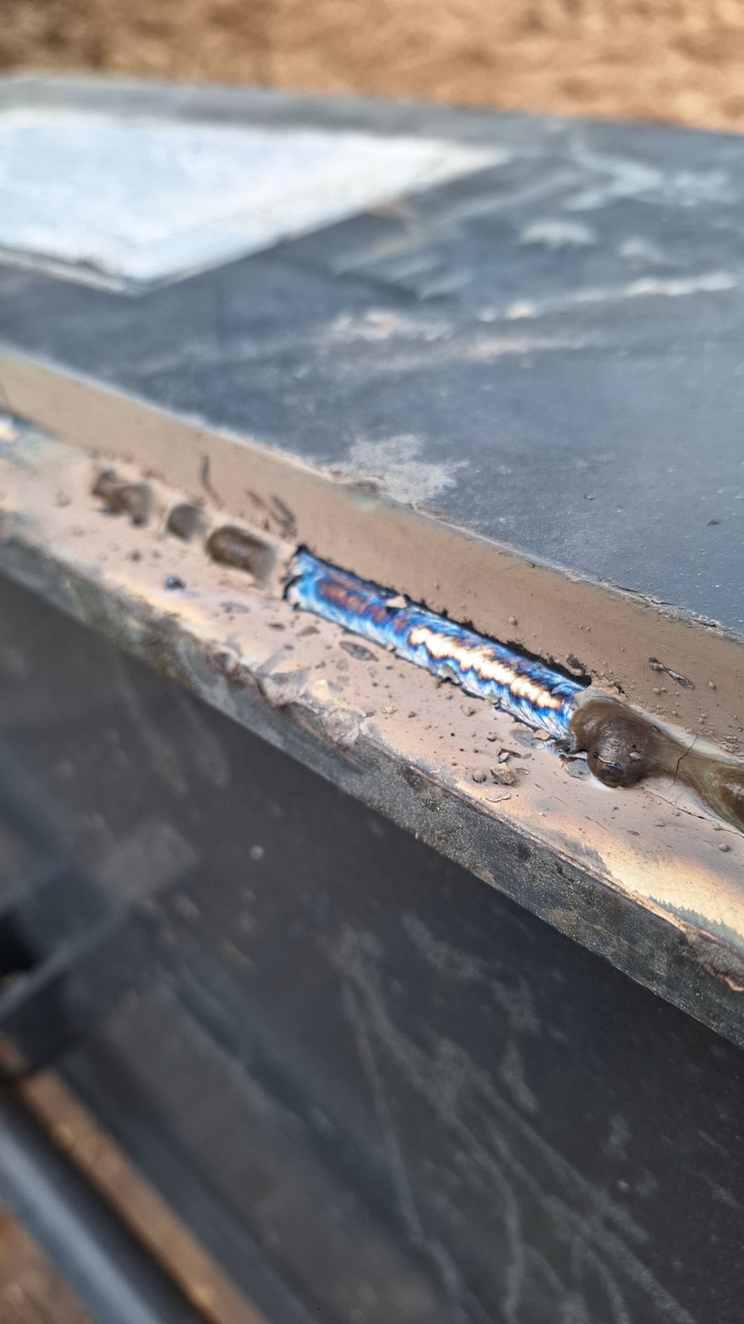 A close up of a piece of metal on a table.