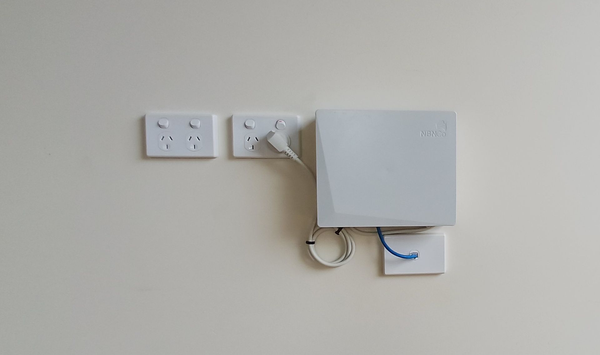 Wall-Mounted White Telecom Box And Outlets — Green Valley Electrical in Alstonville, NSW