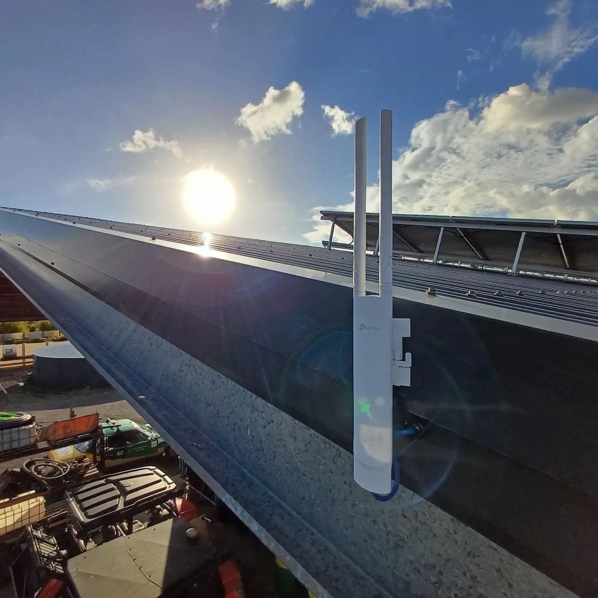 Solar Panel Close-Up at Sunset with Two White Antenna-Like Devices Mounted — Green Valley Electrical in Lismore, NSW