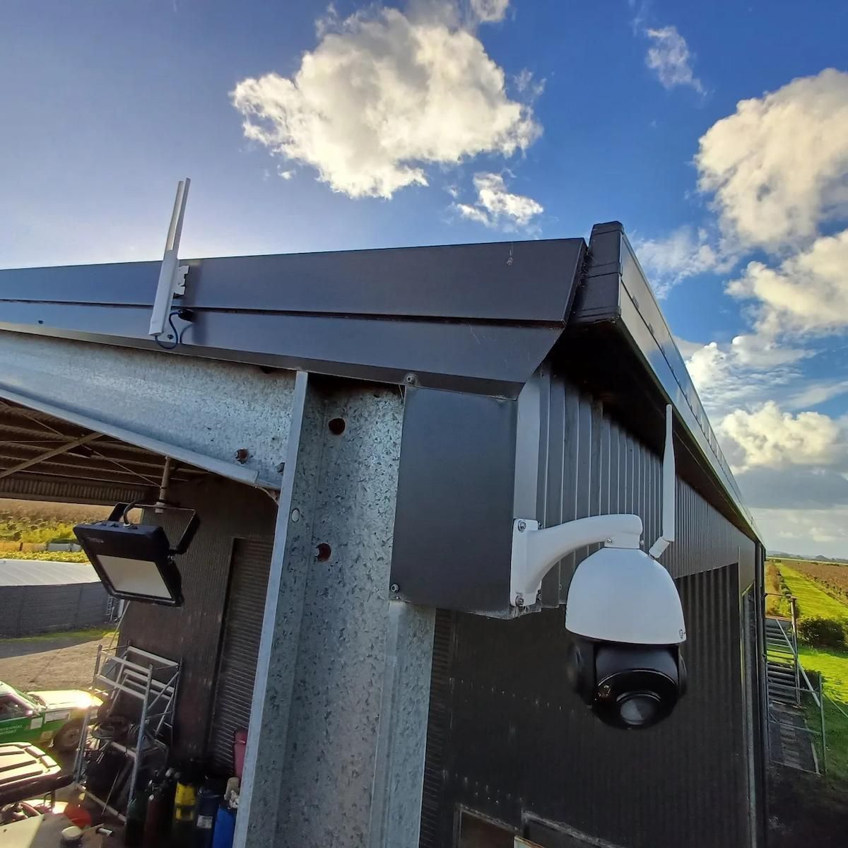 Corner of A Building with A White Security Camera Mounted — Green Valley Electrical in Ballina, NSW