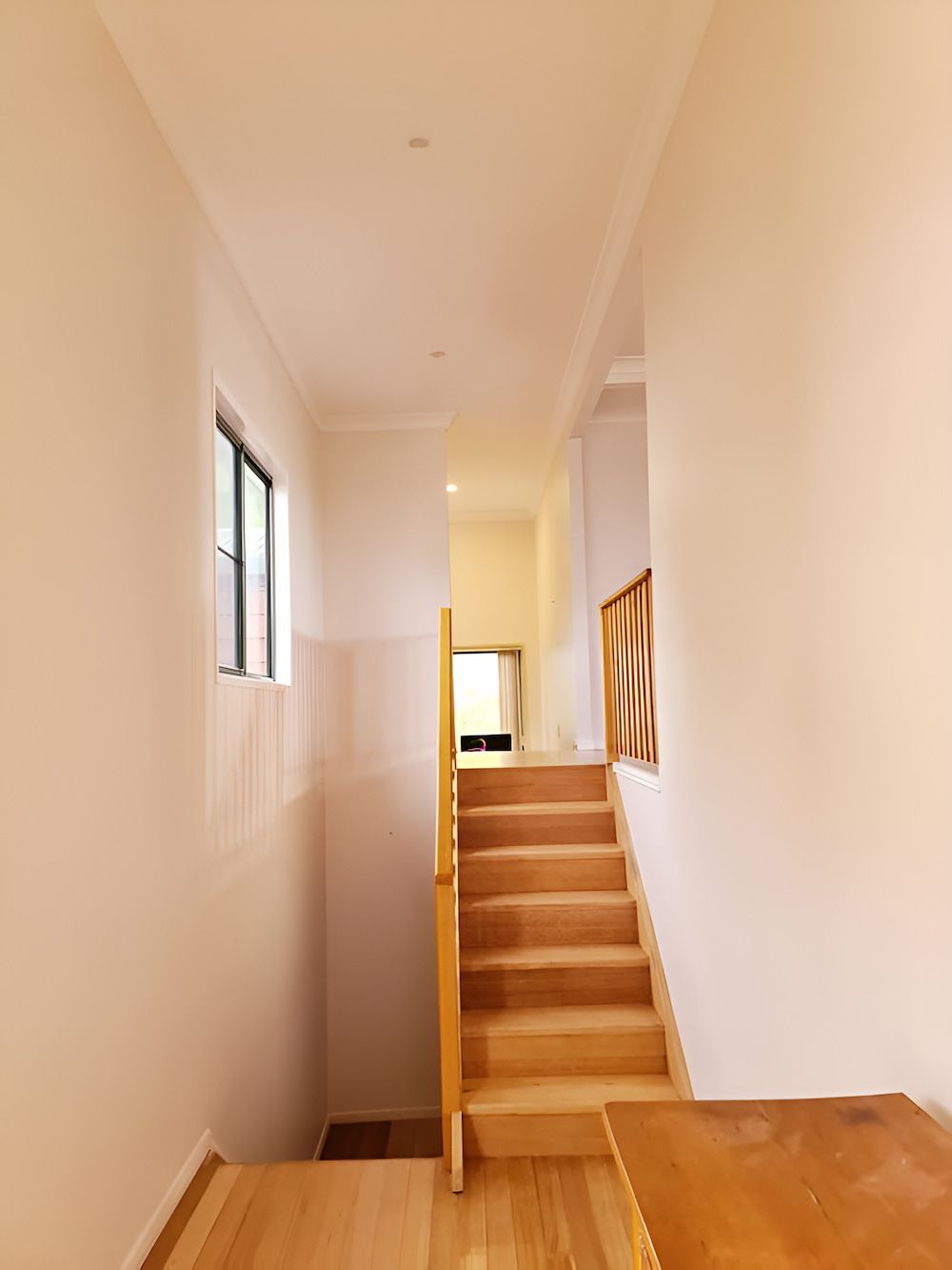 A Wooden Staircase Leading Up to the Second Floor of a House — BK Painting & Property Maintenance in Gracemere, QLD
