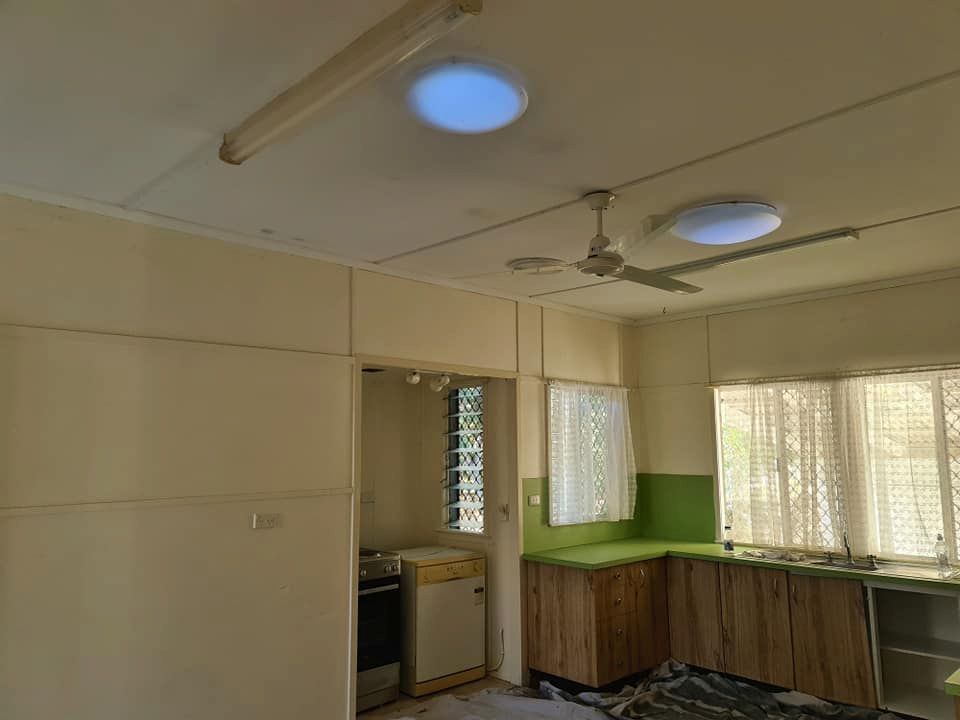 A Kitchen With a Ceiling Fan and a Window — BK Painting & Property Maintenance in Gracemere, QLD