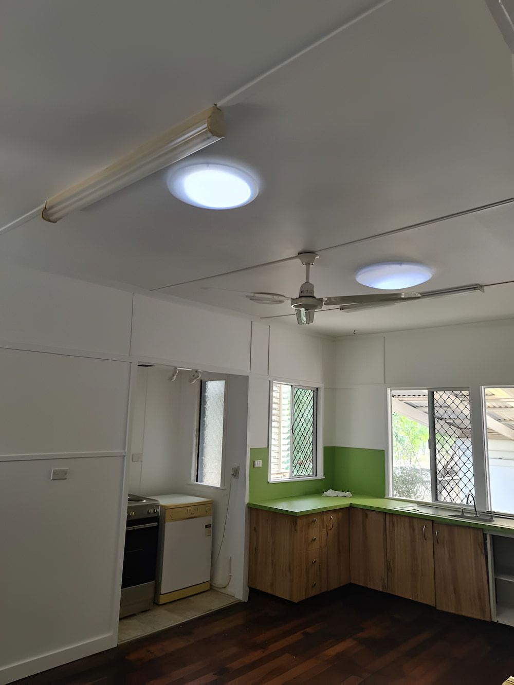A Kitchen With a Ceiling Fan and a Light on the Ceiling — BK Painting & Property Maintenance in Gracemere, QLD