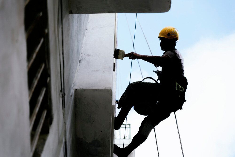 A Ladder is Sitting in Front of a Building Under Construction — BK Painting & Property Maintenance in Emerald, QLD