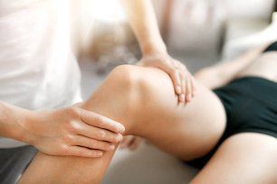 A Woman Is Getting a Massage on Her Leg — Illawarra Sports Injury Rehabilitation and Physiotherapy Centre in Bellambi, NSW
